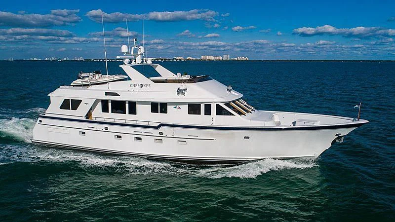 a white boat in the water aboard WELL DONE Yacht for Sale