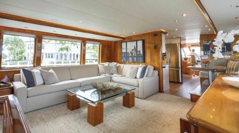 a living room with a couch and a table aboard WELL DONE Yacht for Sale