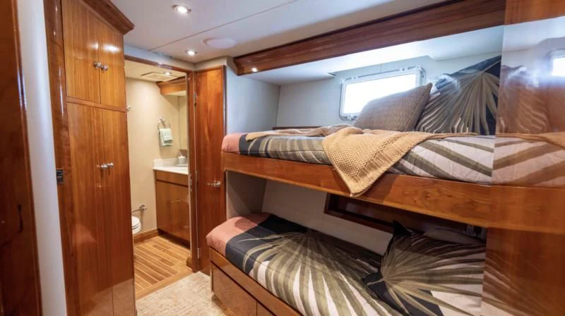 a bed in a room aboard WELL DONE Yacht for Sale