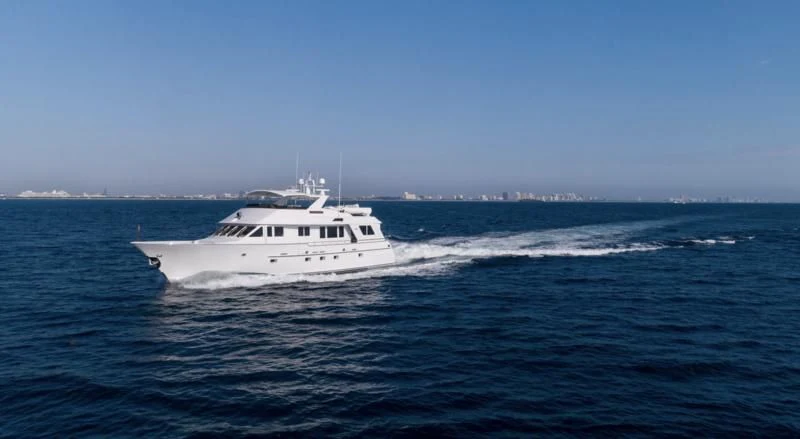 a white boat in the water aboard WELL DONE Yacht for Sale