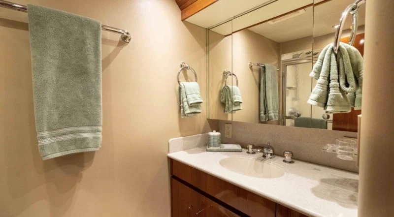 a bathroom with a towel on the wall aboard WELL DONE Yacht for Sale