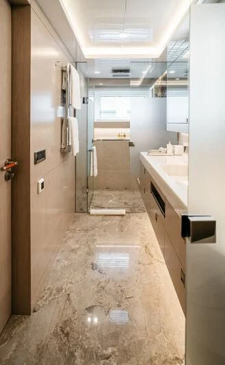 a long hallway with a sink and cabinets aboard HEEUS Yacht for Sale