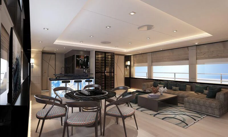 a living room with a large screen aboard HEEUS Yacht for Sale
