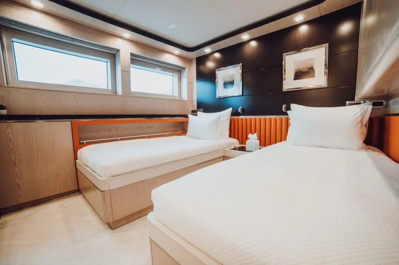 a room with two beds aboard HEEUS Yacht for Sale