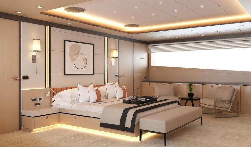 a room with a bed and a chair aboard HEEUS Yacht for Sale