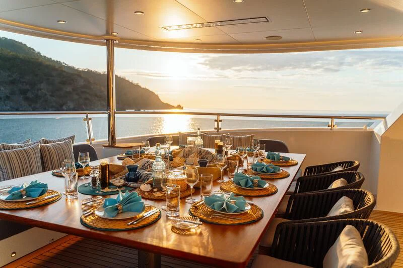 a table set for a dinner aboard HEEUS Yacht for Sale
