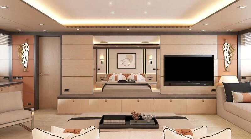 a room with a tv and couches aboard HEEUS Yacht for Sale