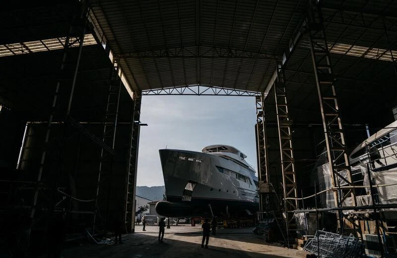 a large space shuttle in a warehouse aboard HEEUS Yacht for Sale