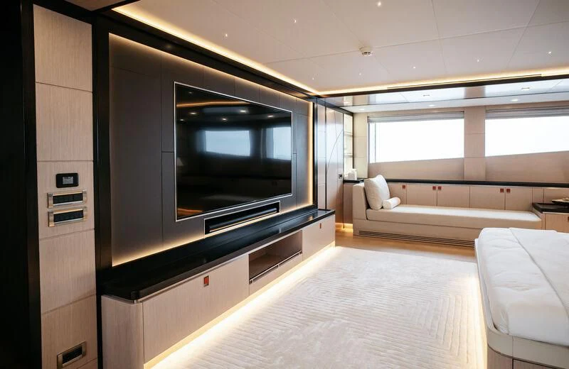 a room with a tv and a bed aboard HEEUS Yacht for Sale