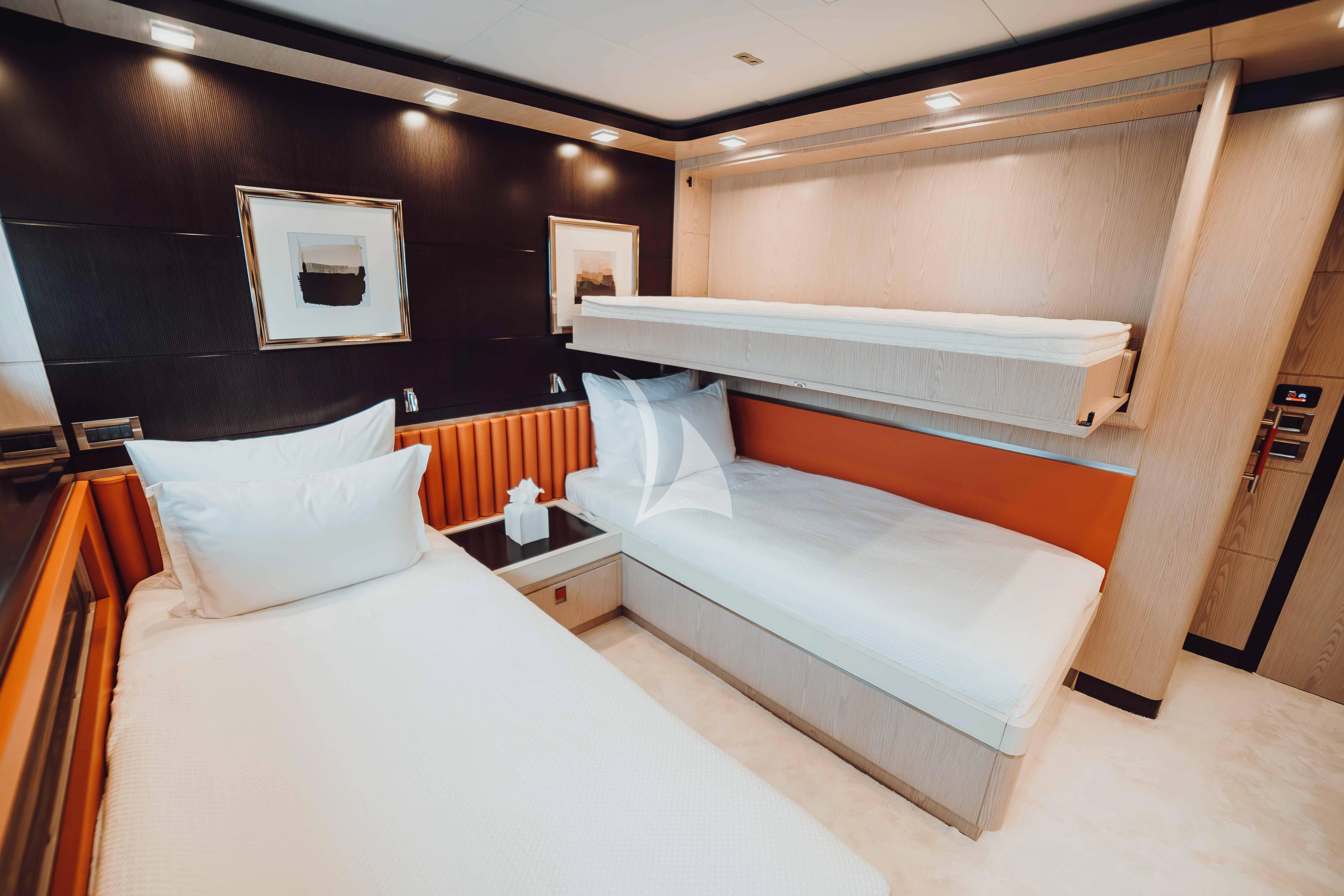 a room with two beds aboard HEEUS Yacht for Sale