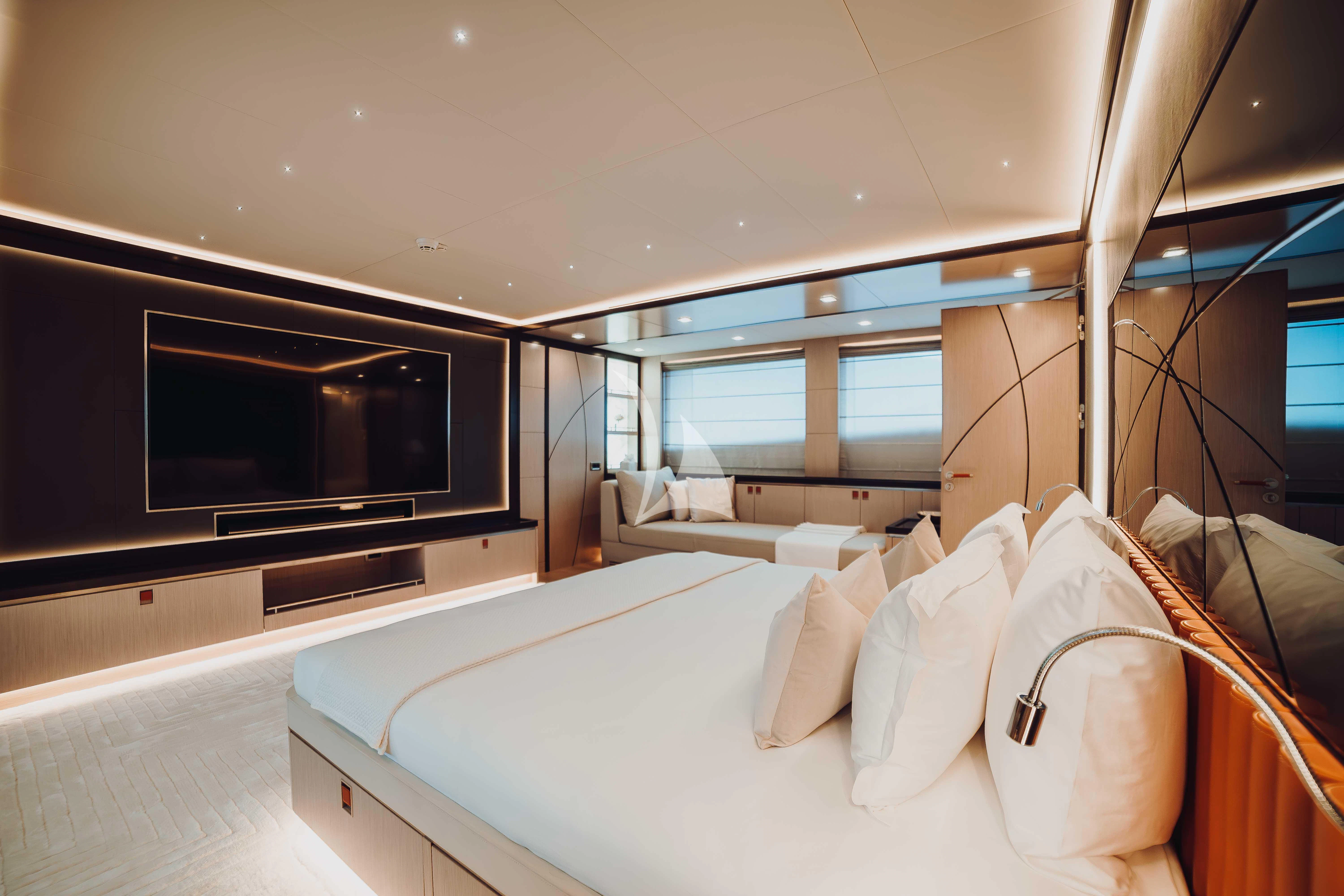 a room with a bed and a tv aboard HEEUS Yacht for Sale