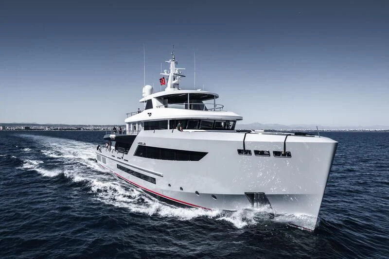 a large white boat on the water aboard HEEUS Yacht for Sale