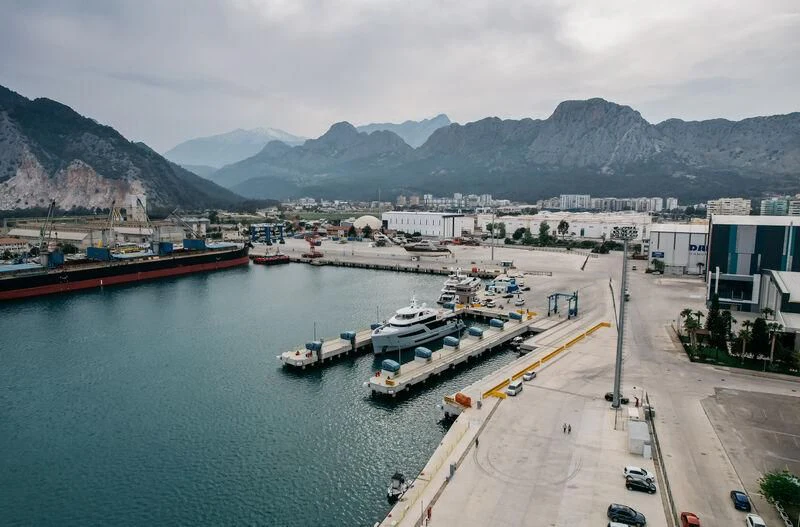 a port with boats and buildings aboard HEEUS Yacht for Sale