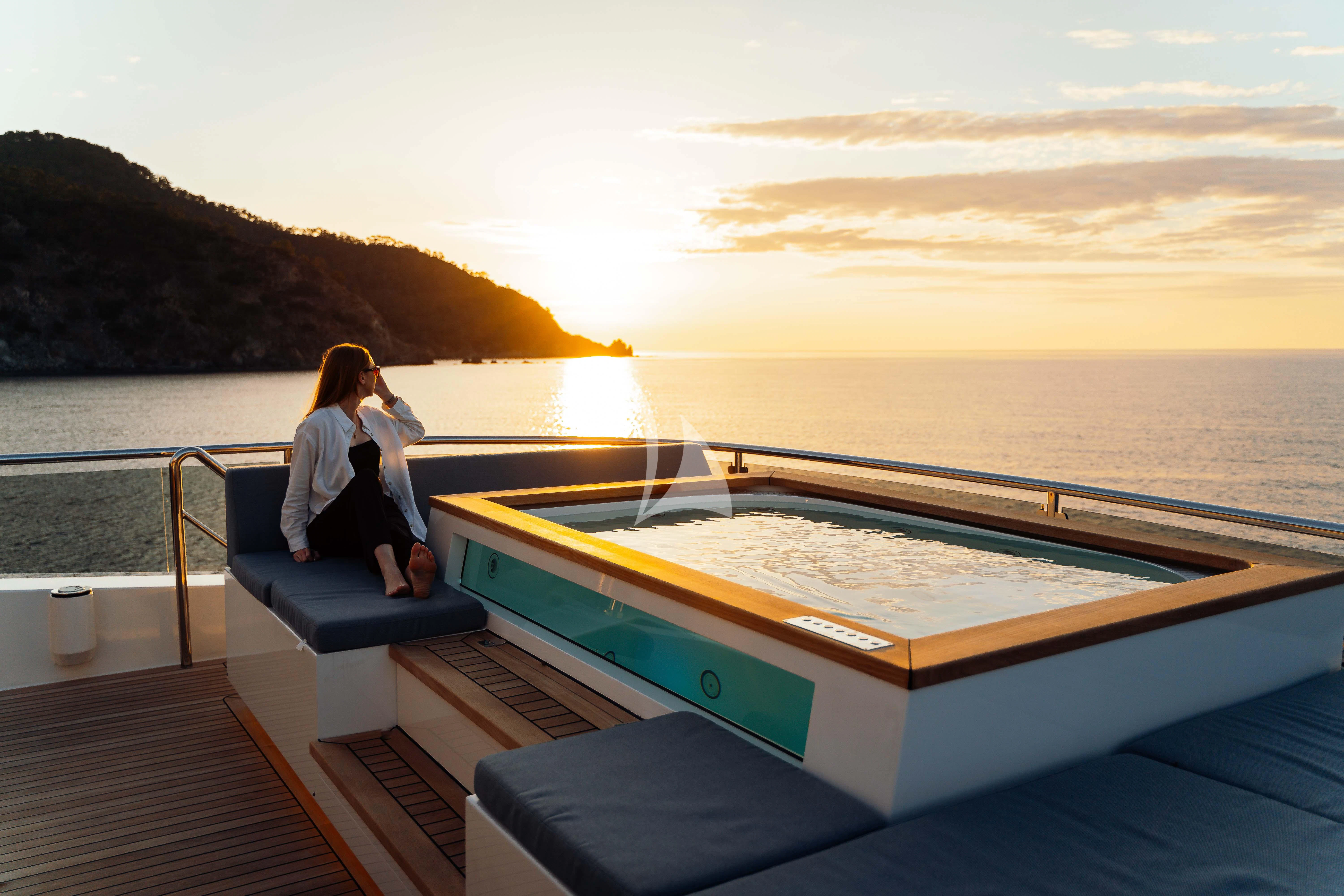 a person sitting on a boat aboard HEEUS Yacht for Sale