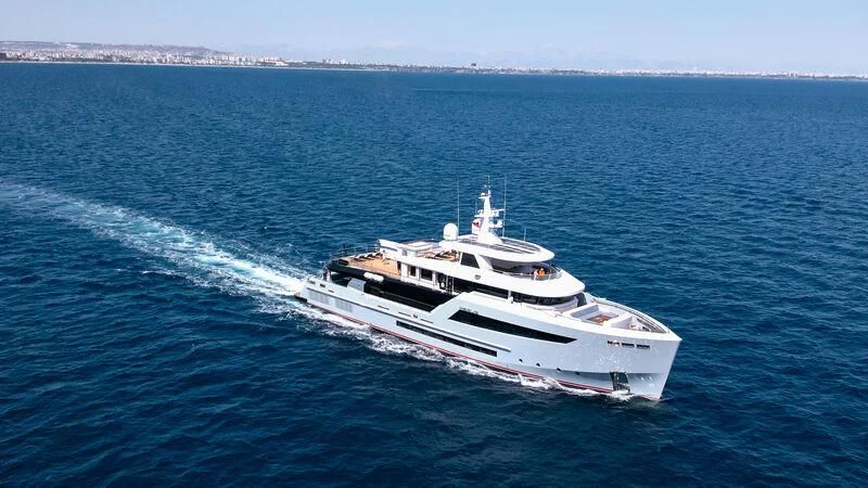 a large white ship in the water aboard HEEUS Yacht for Sale