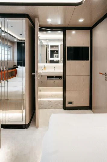 a bathroom with a glass shower aboard HEEUS Yacht for Sale