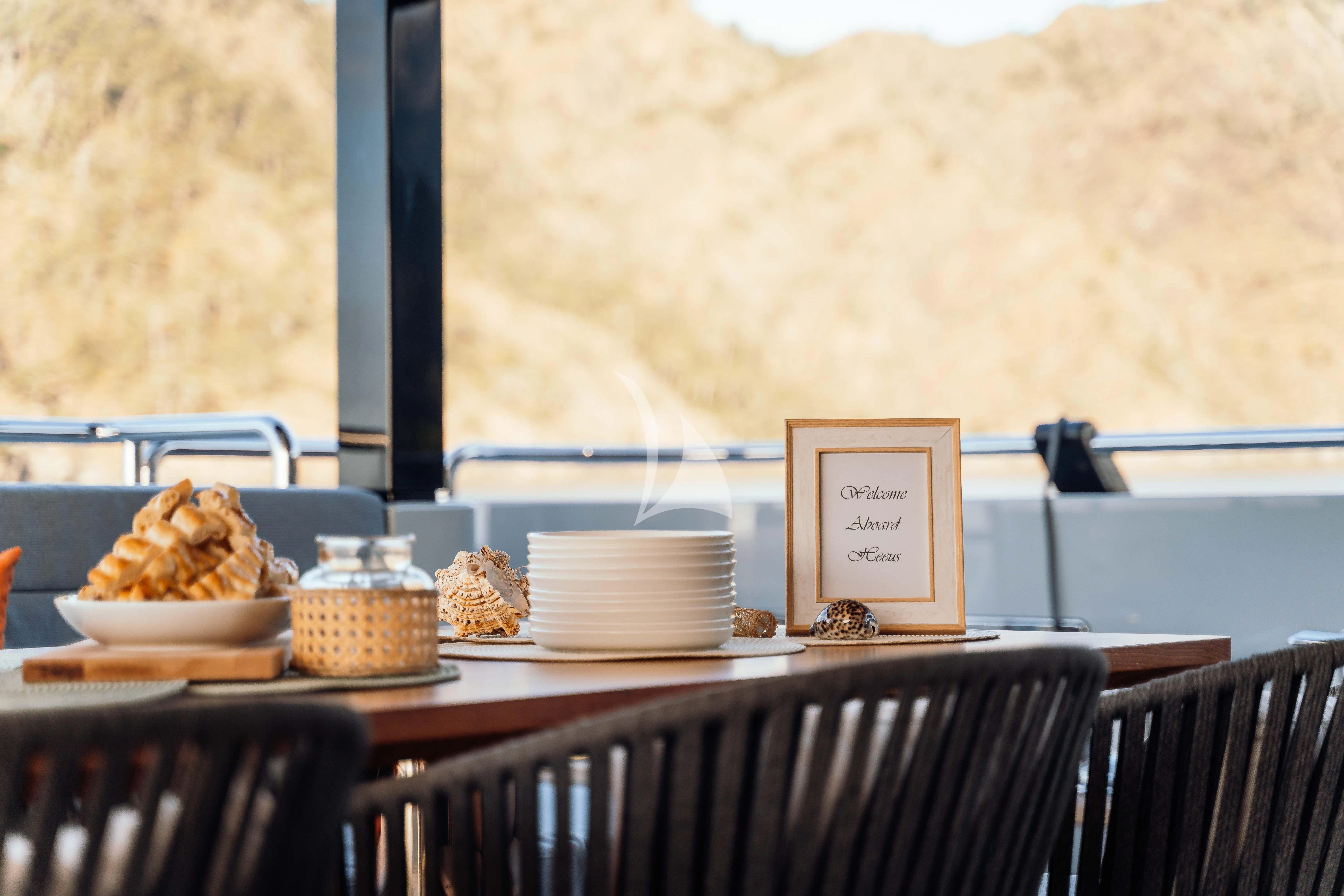 a table with food on it aboard HEEUS Yacht for Sale