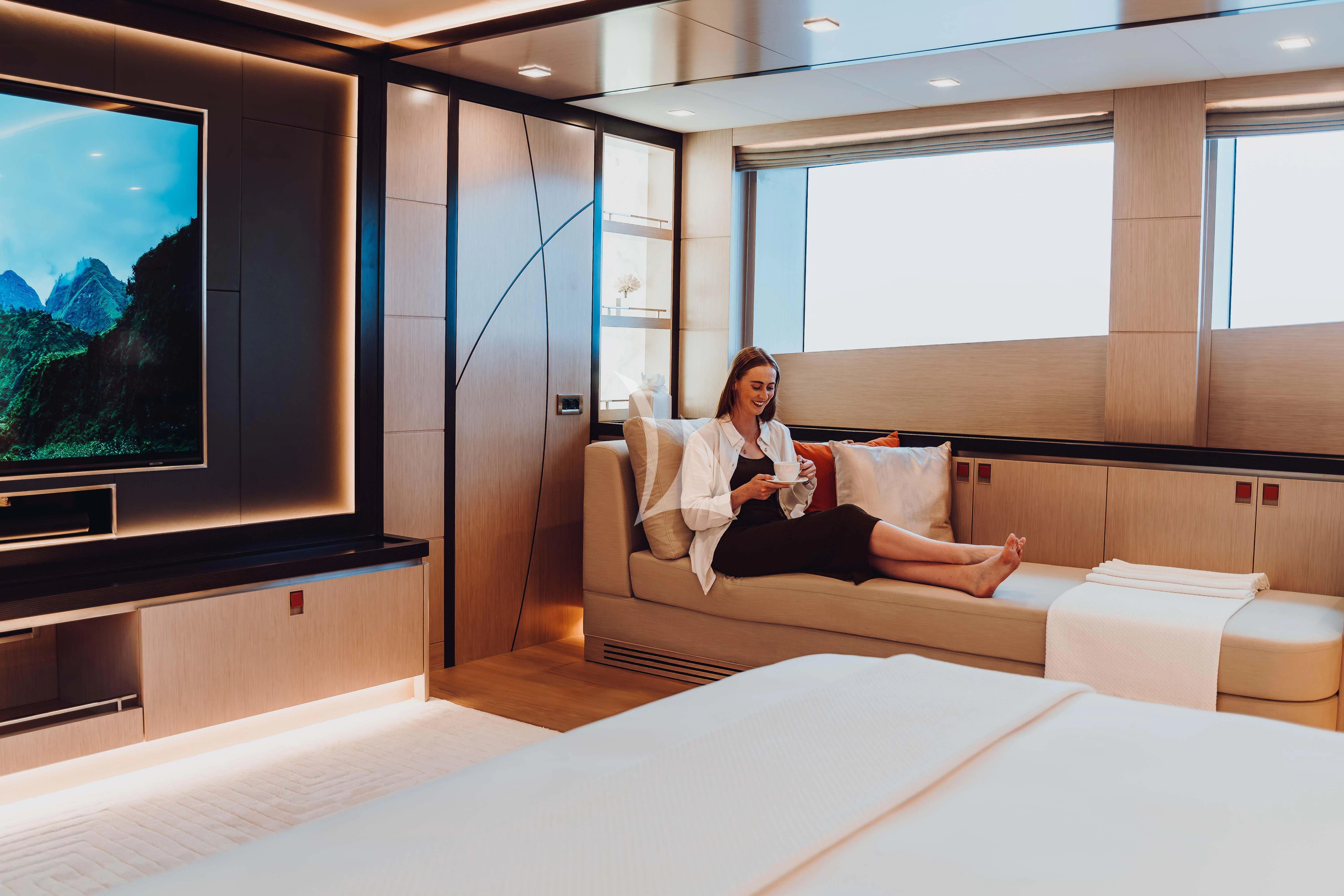 a person sitting on a couch aboard HEEUS Yacht for Sale