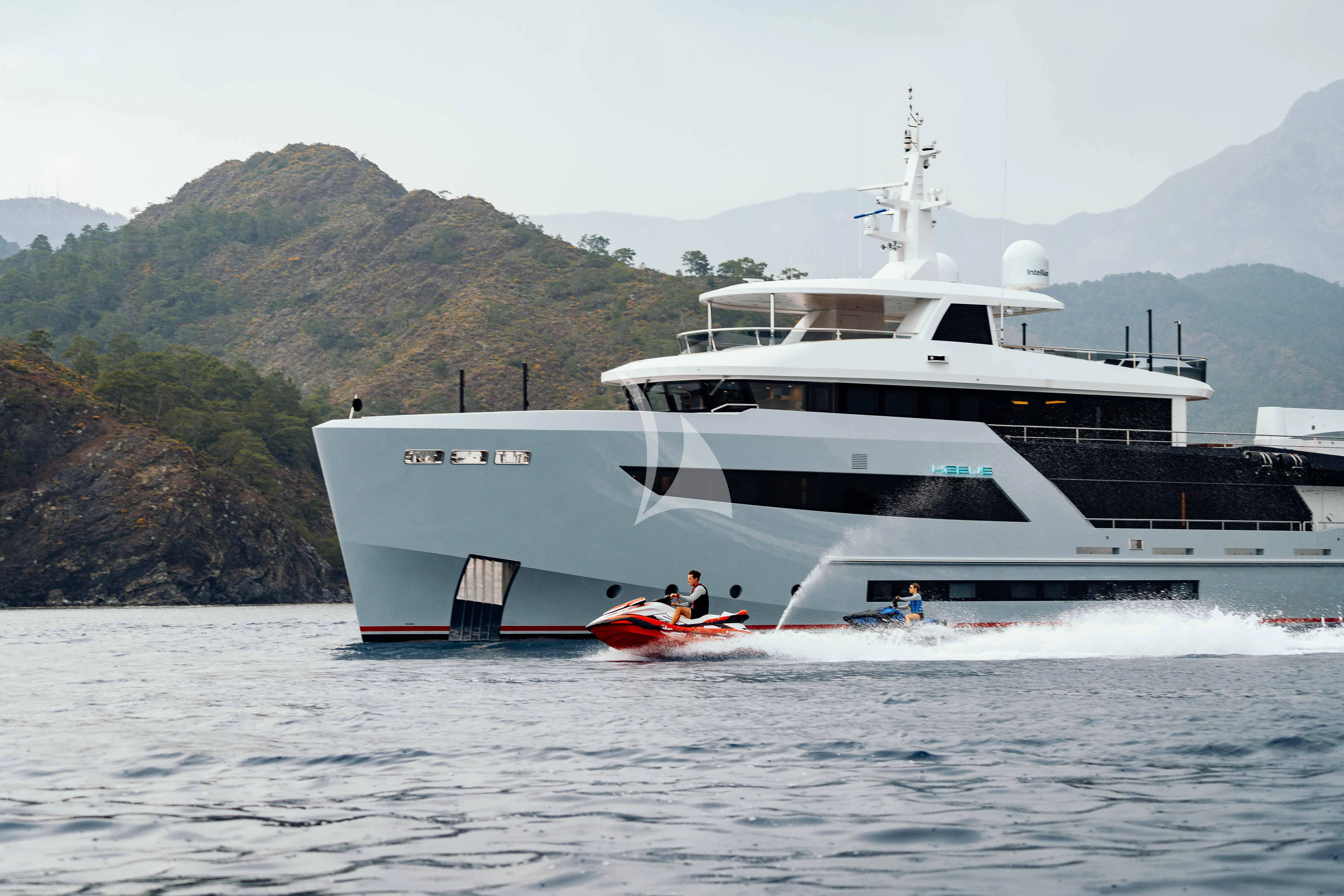 a large white boat on the water aboard HEEUS Yacht for Sale
