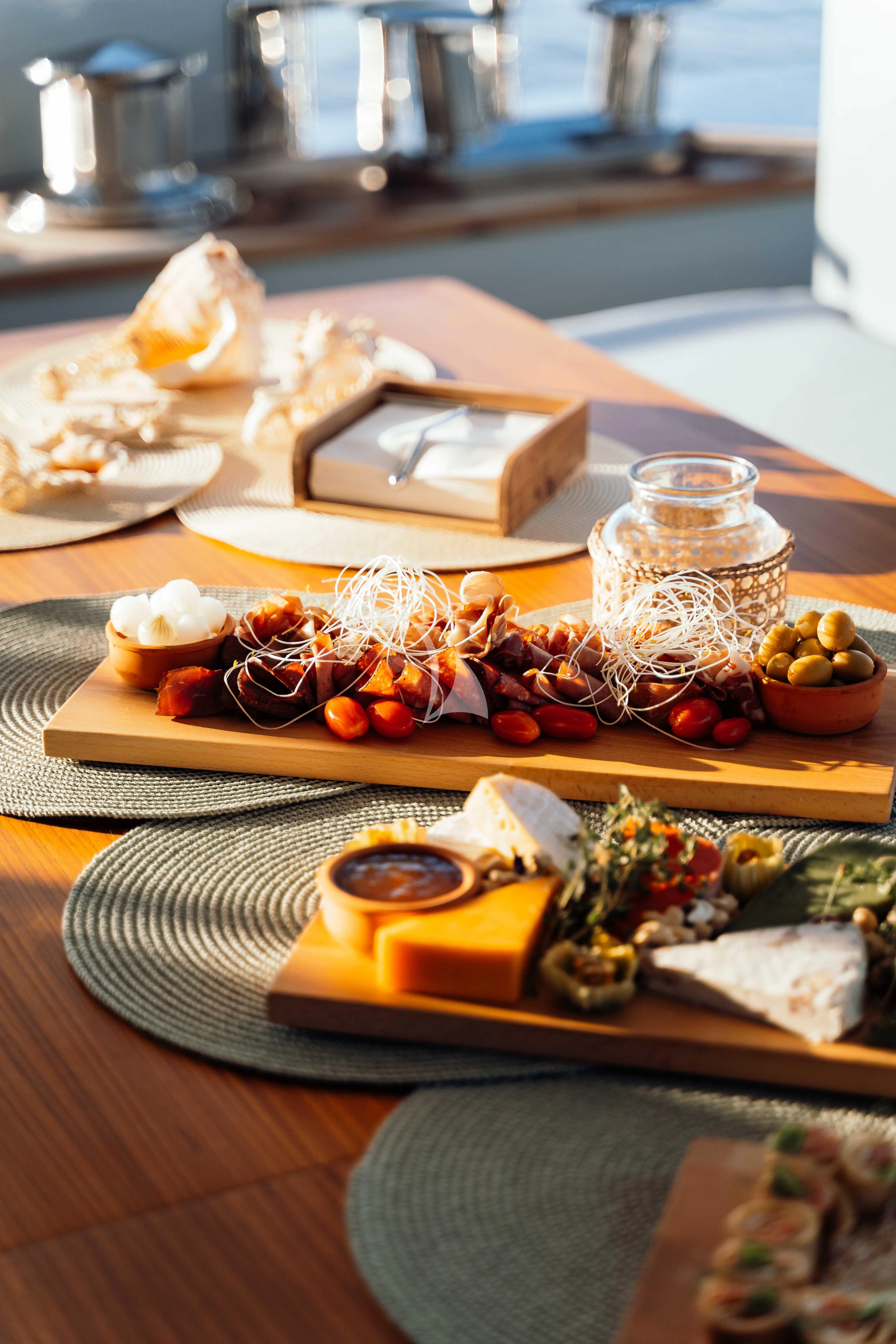 a table with food on it aboard HEEUS Yacht for Sale