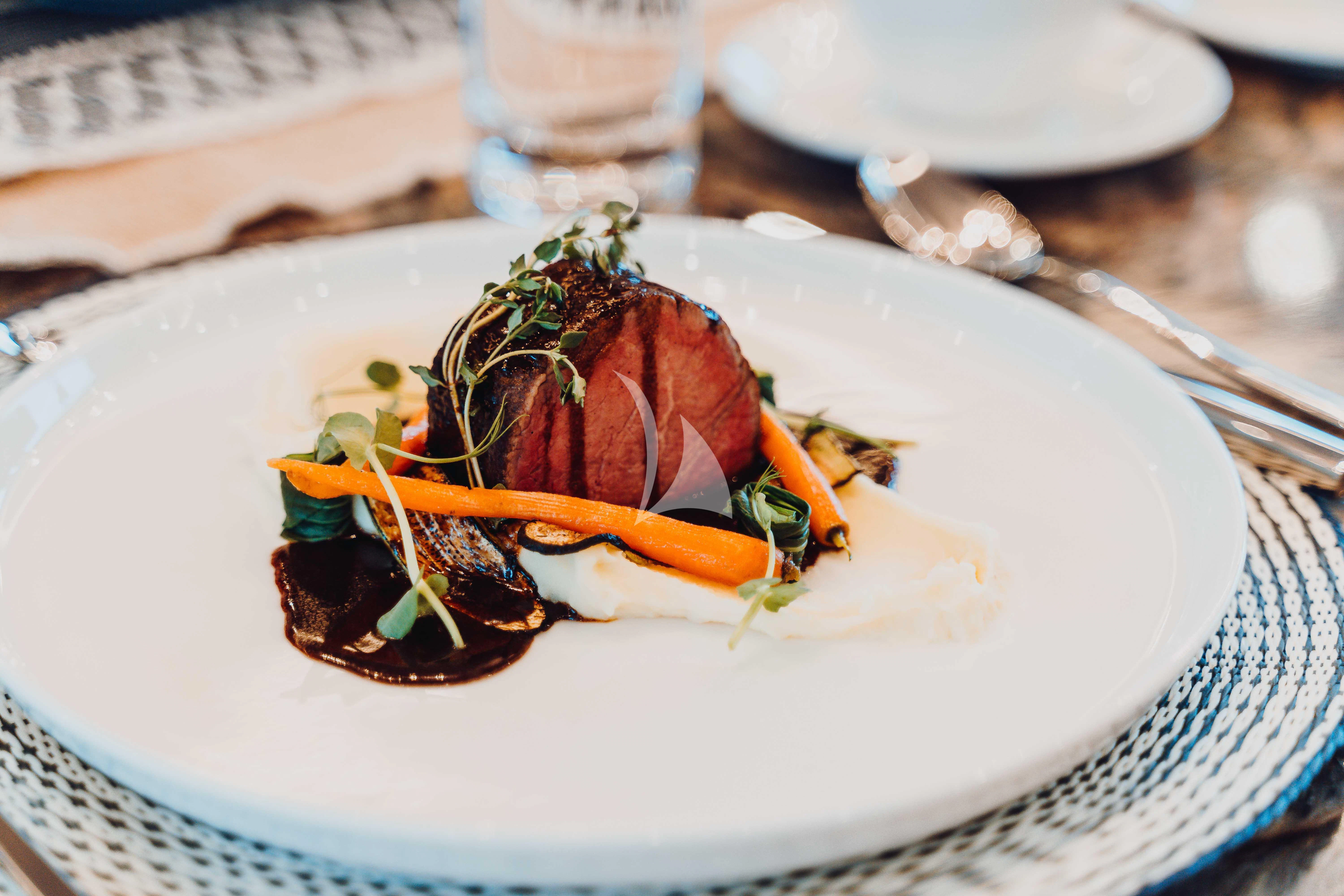 a plate of food aboard HEEUS Yacht for Sale