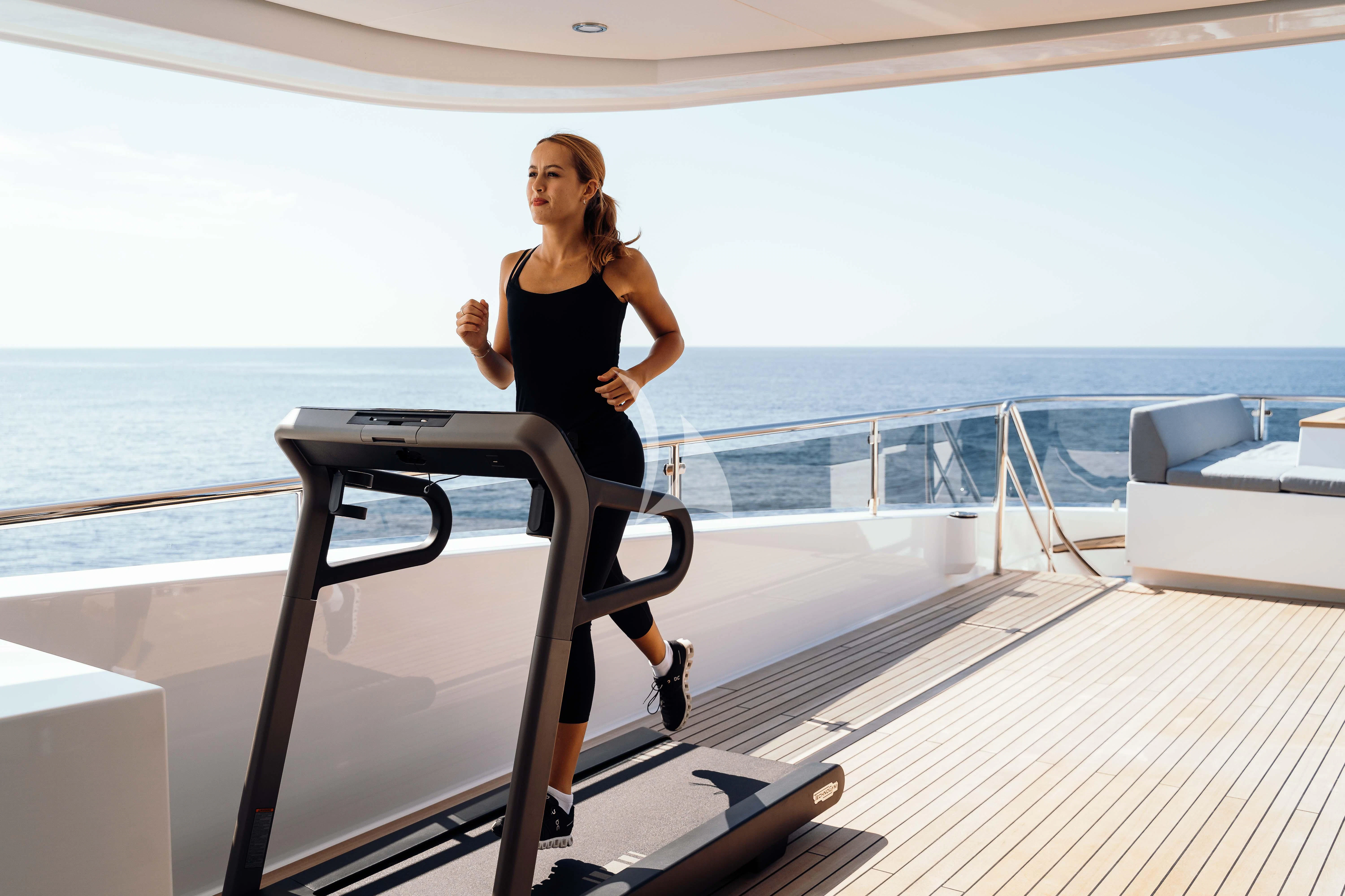 a person running on a deck aboard HEEUS Yacht for Sale