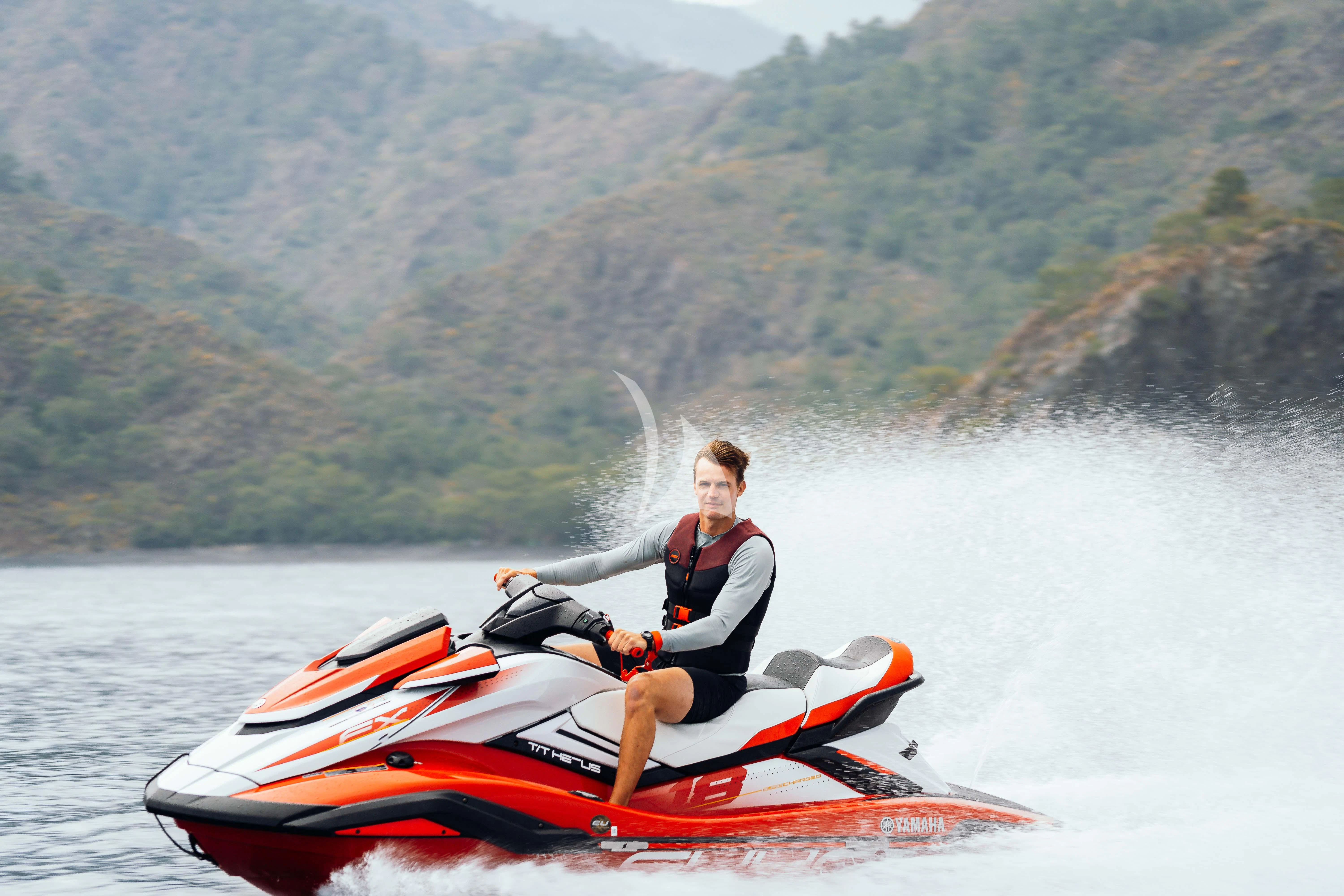 a man in a kayak aboard HEEUS Yacht for Sale
