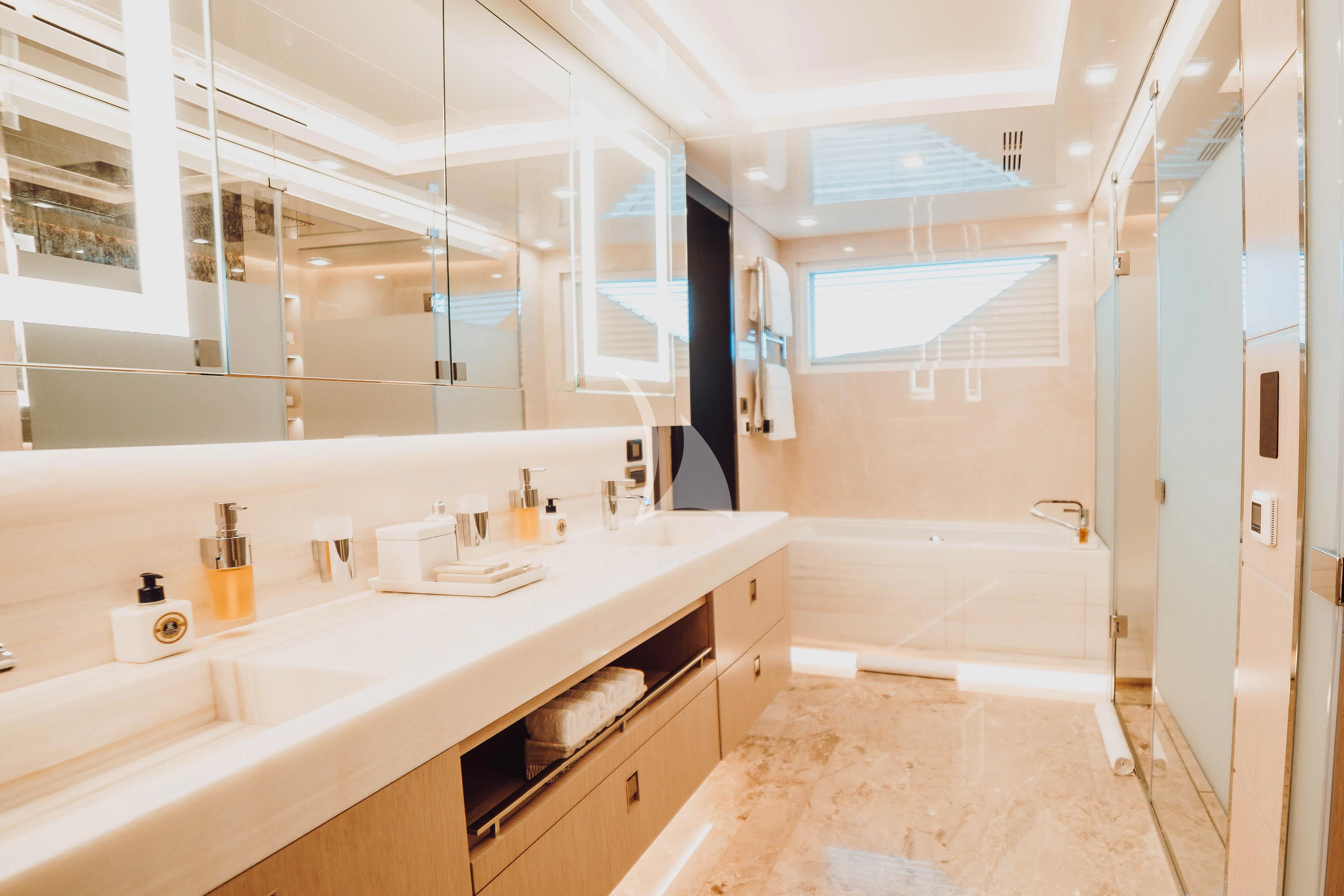 a bathroom with a large mirror aboard HEEUS Yacht for Sale