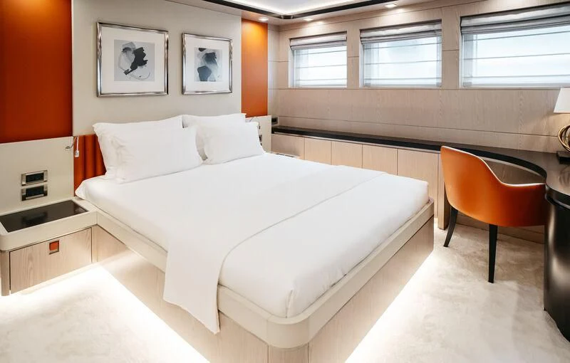 a bed with white sheets aboard HEEUS Yacht for Sale