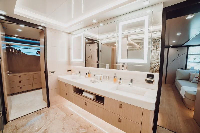 a bathroom with a large mirror aboard HEEUS Yacht for Sale