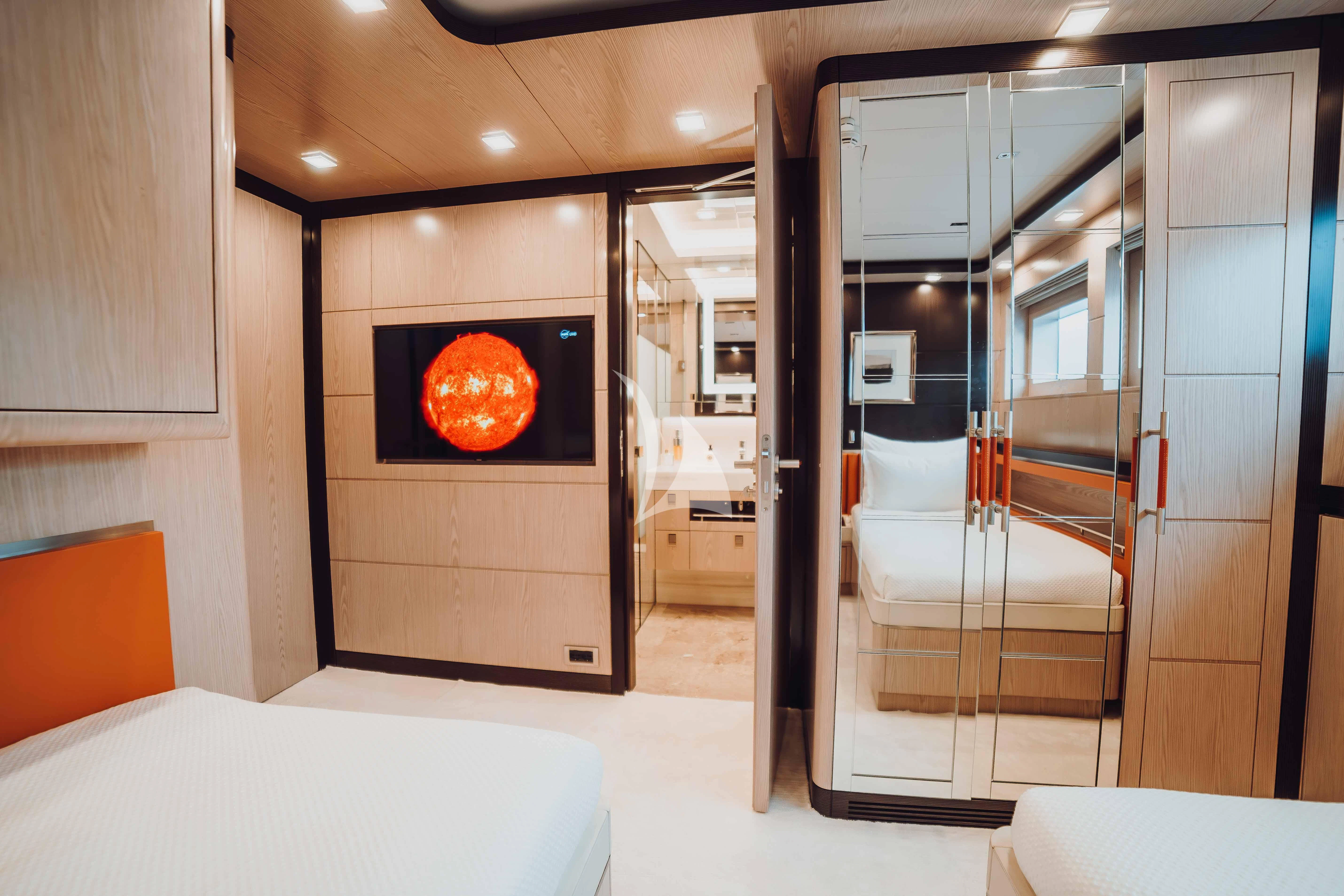 a room with a fireplace aboard HEEUS Yacht for Sale