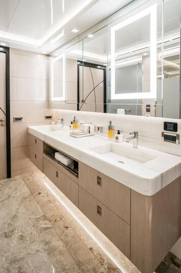 a bathroom with a large mirror aboard HEEUS Yacht for Sale