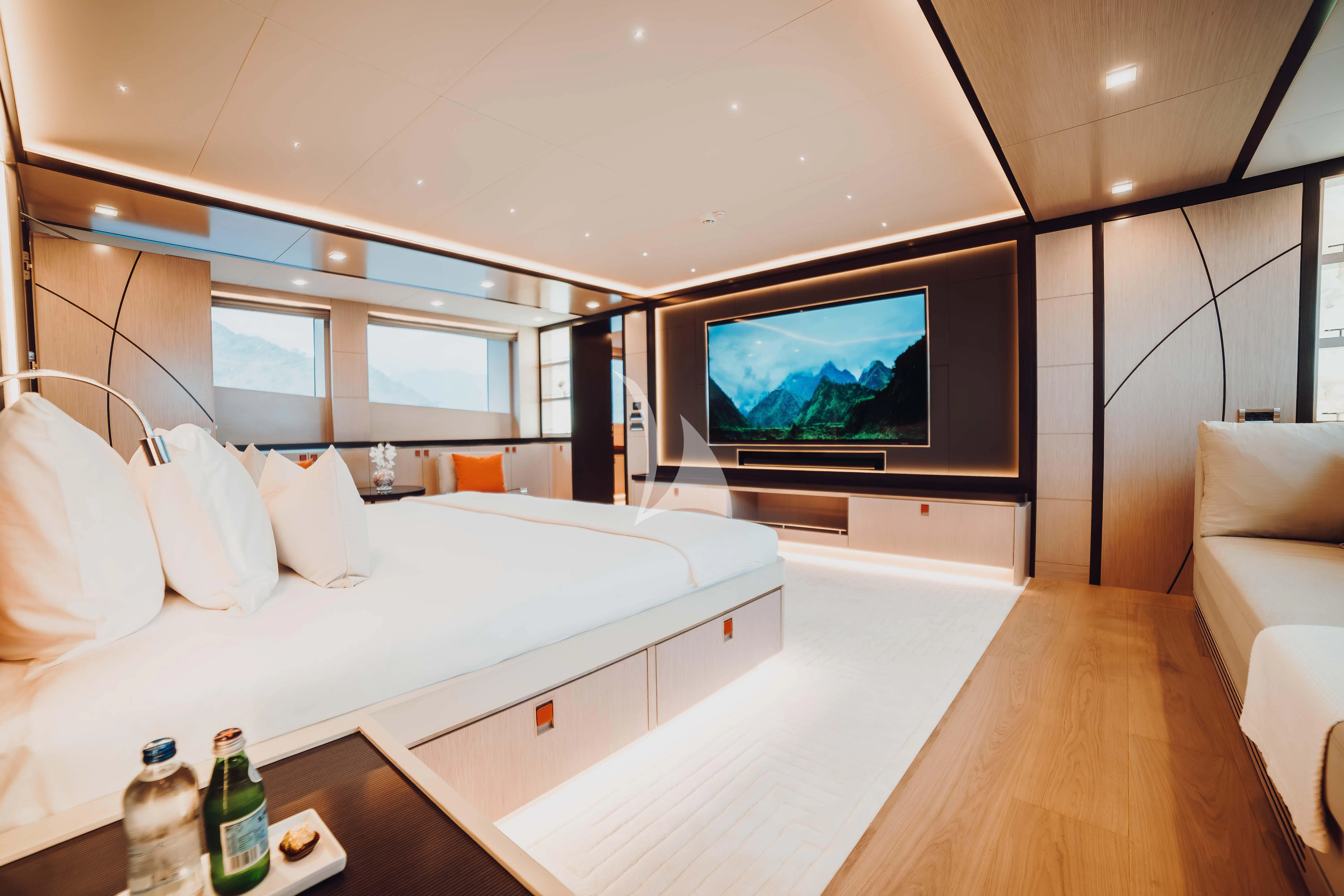 a room with a large television and a couch aboard HEEUS Yacht for Sale