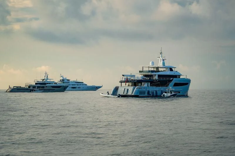 a group of boats in the water aboard HEEUS Yacht for Sale