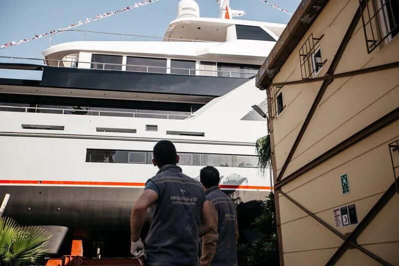 a group of people standing outside of a boat aboard HEEUS Yacht for Sale