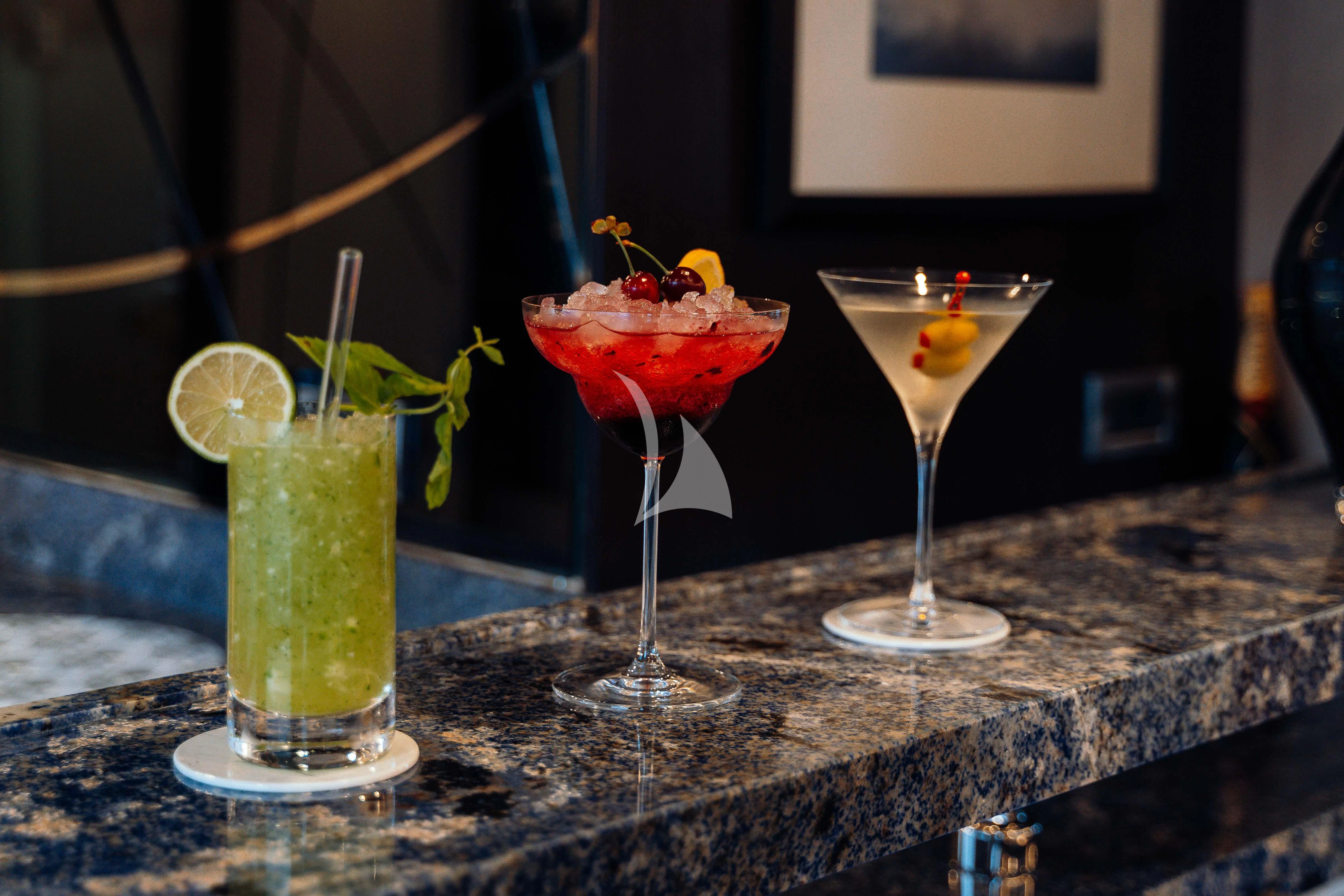 a couple of glasses with drinks in them aboard HEEUS Yacht for Sale