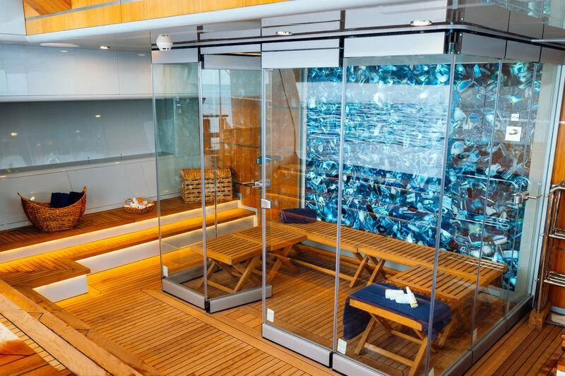 a room with glass walls and a bench aboard HEEUS Yacht for Sale