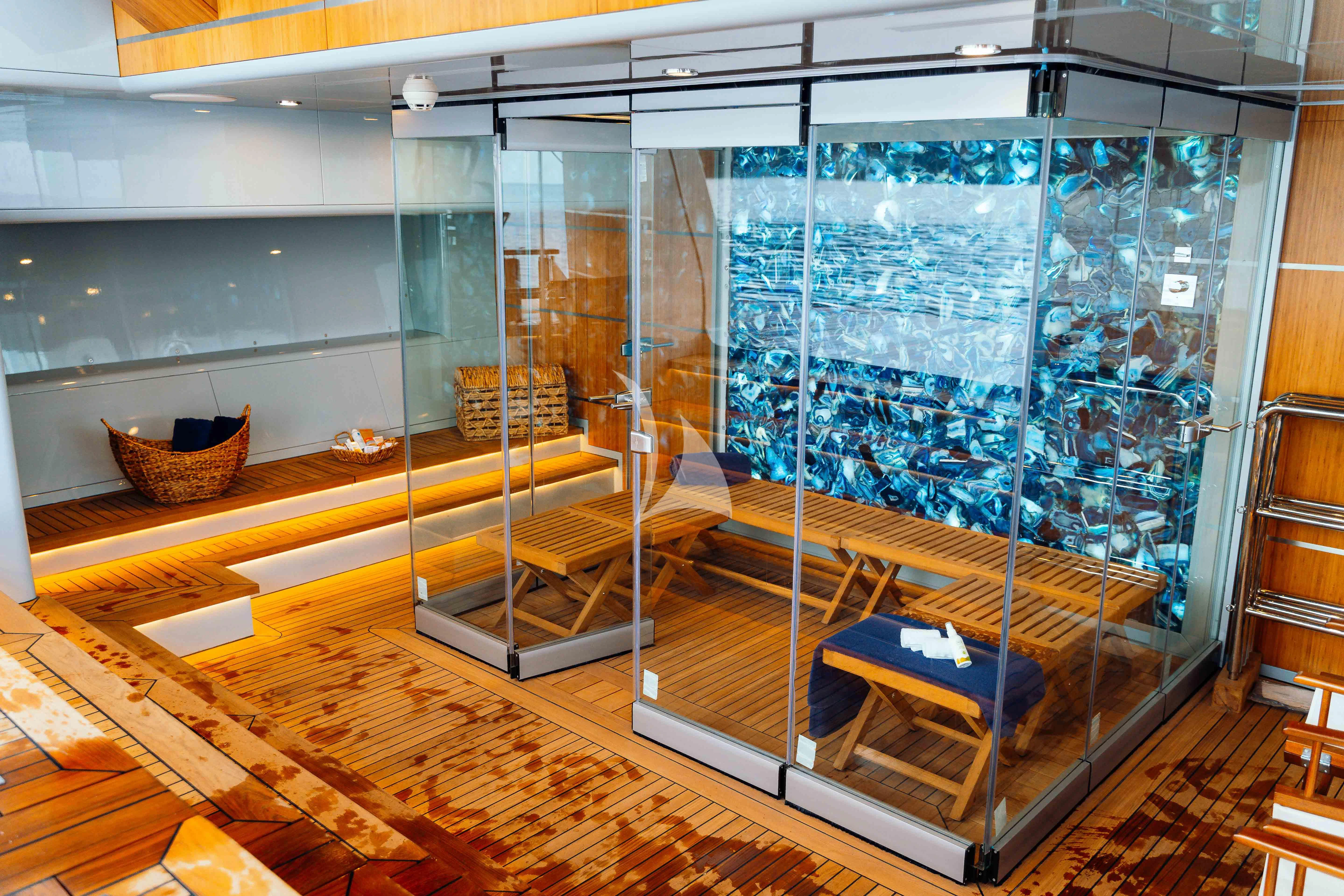 a room with glass walls aboard HEEUS Yacht for Sale