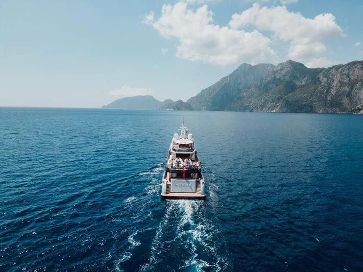 a boat sailing on the sea aboard HEEUS Yacht for Sale