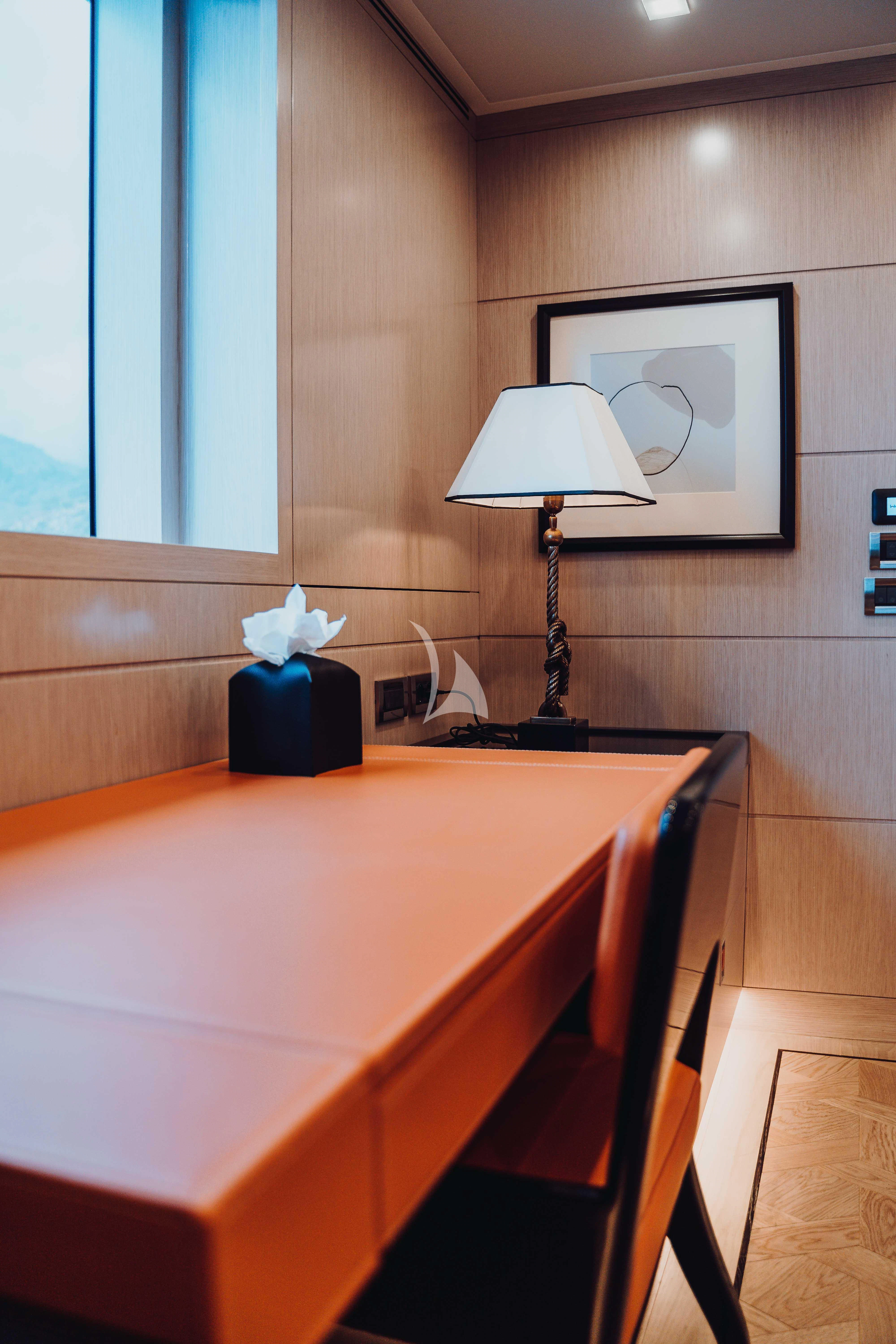 a lamp on a table aboard HEEUS Yacht for Sale