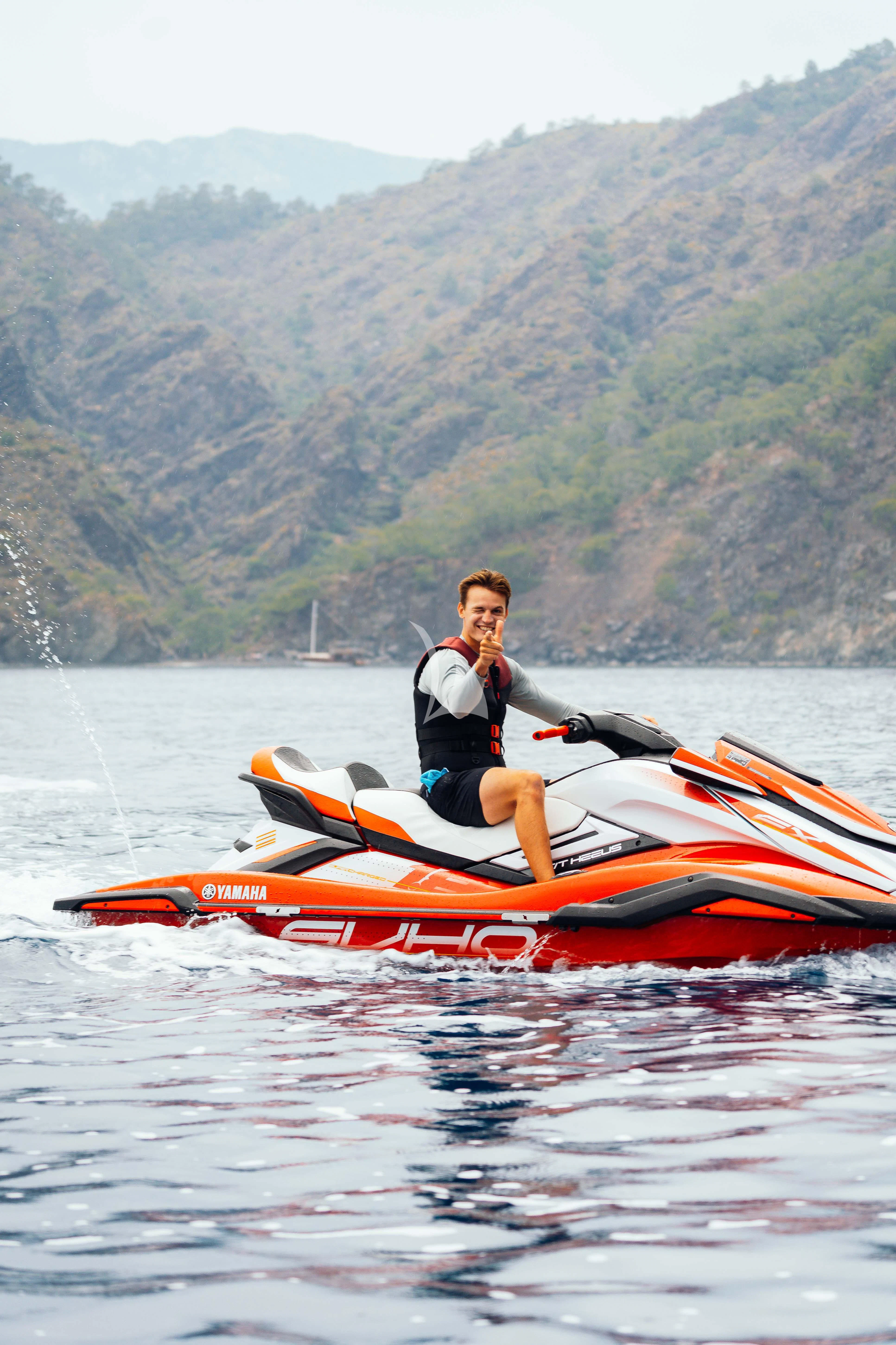 a man in a kayak aboard HEEUS Yacht for Sale