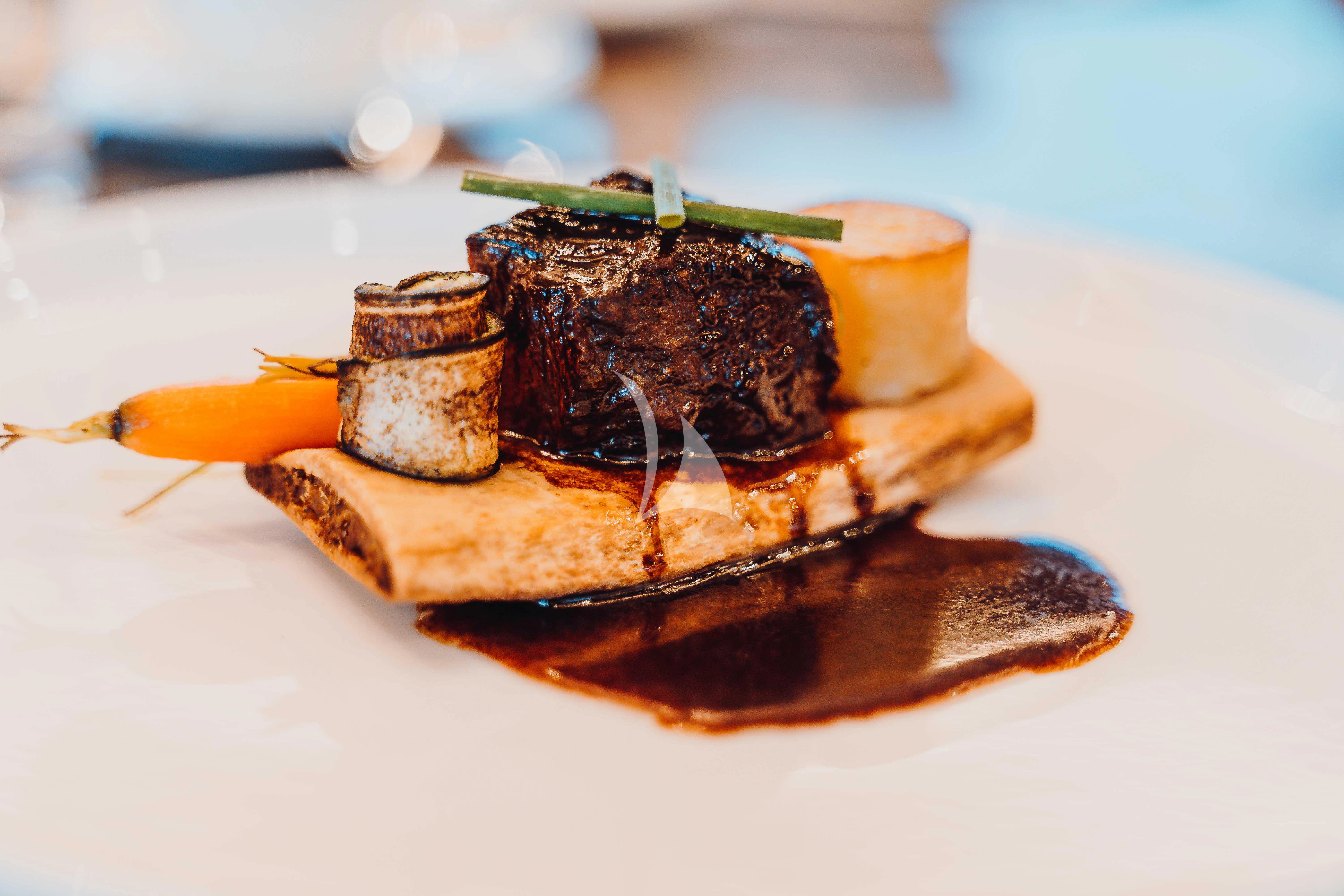 a plate of food aboard HEEUS Yacht for Sale