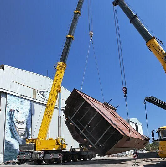 a large machine with a large piece of metal on it aboard HEEUS Yacht for Sale
