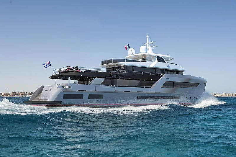 a large boat on the water aboard HEEUS Yacht for Sale