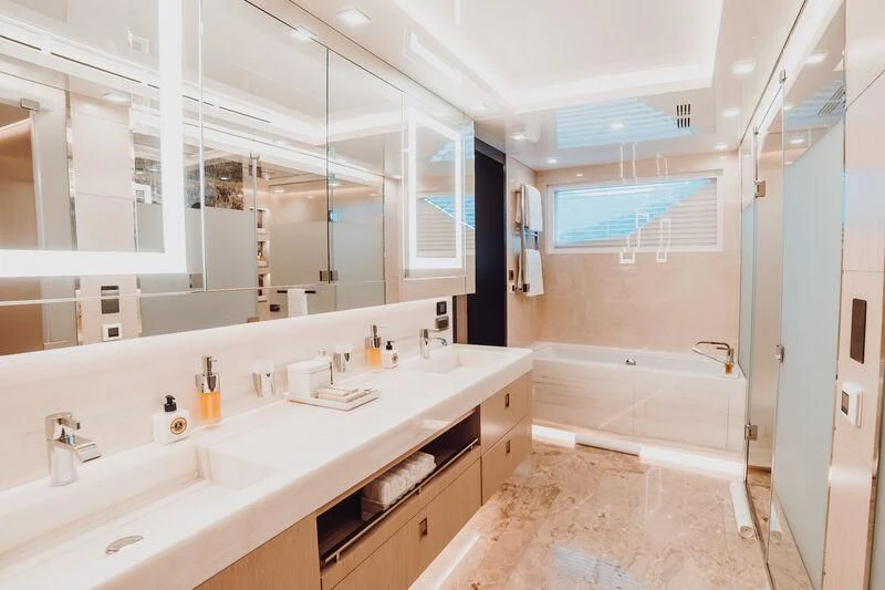 a bathroom with a large mirror aboard HEEUS Yacht for Sale
