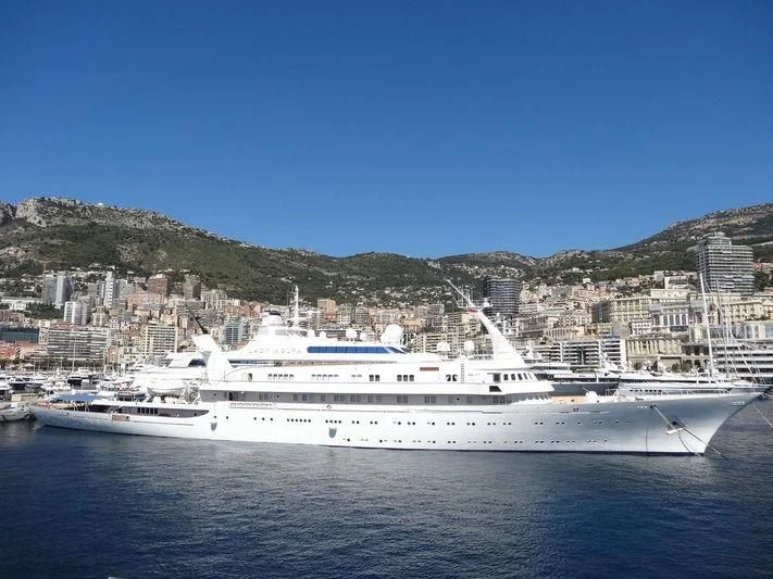 a large white boat in the water aboard ATLANTIS II Yacht for Sale