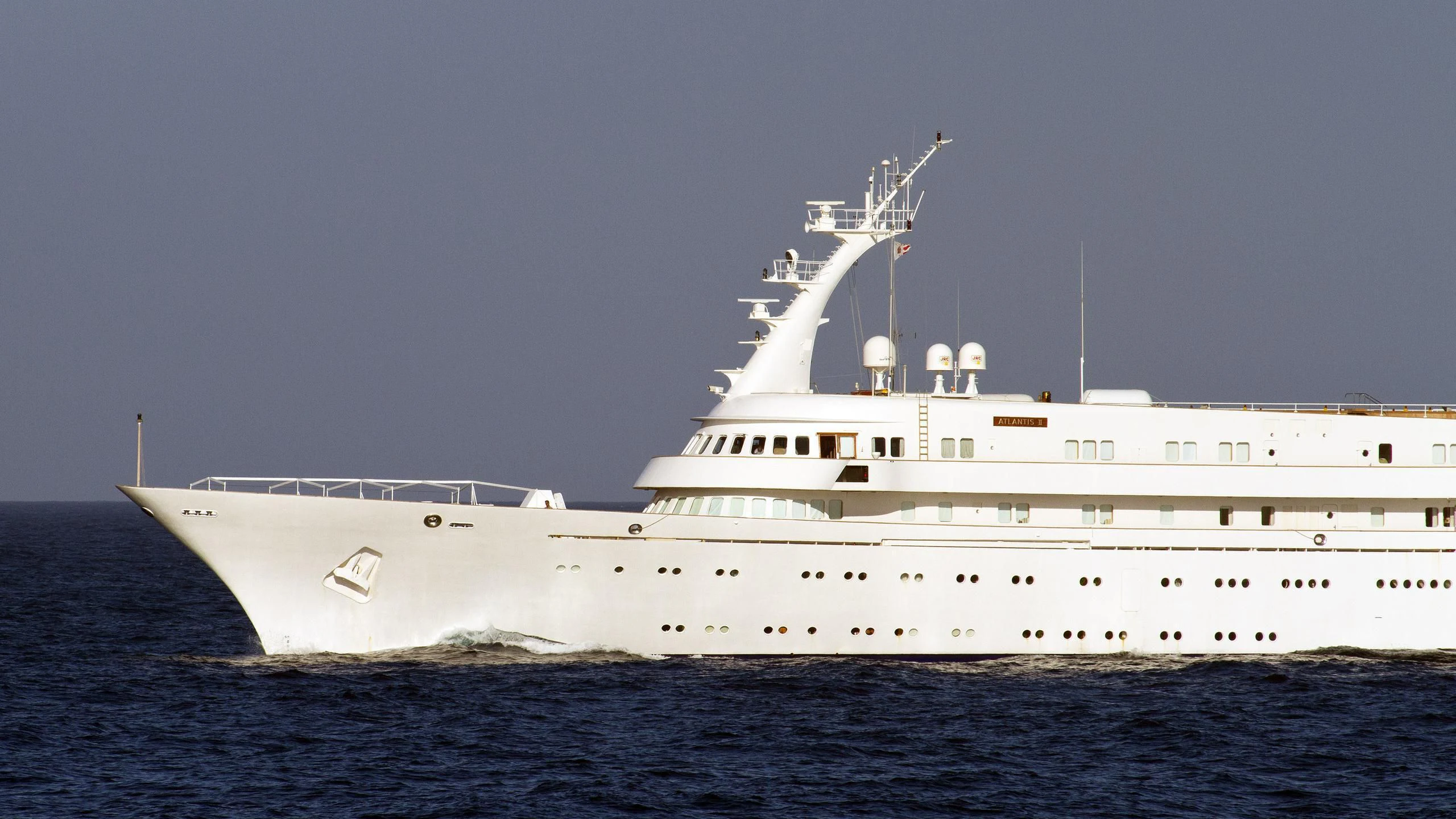 a large white ship in the water aboard ATLANTIS II Yacht for Sale