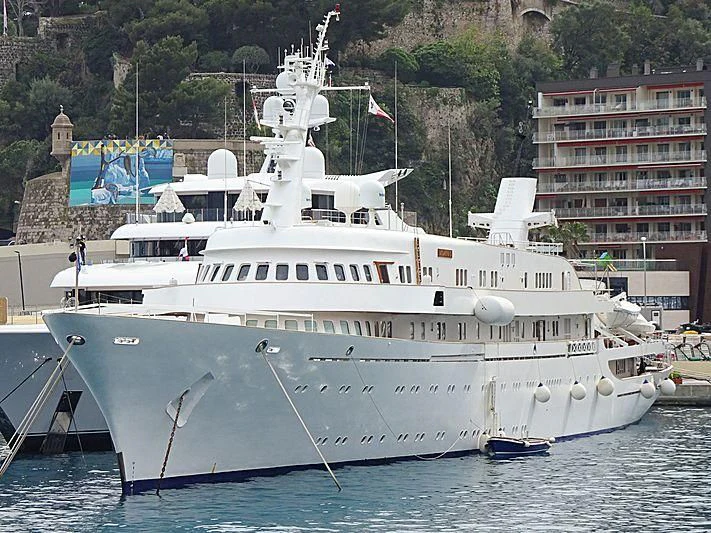 a large white boat in the water aboard ATLANTIS II Yacht for Sale