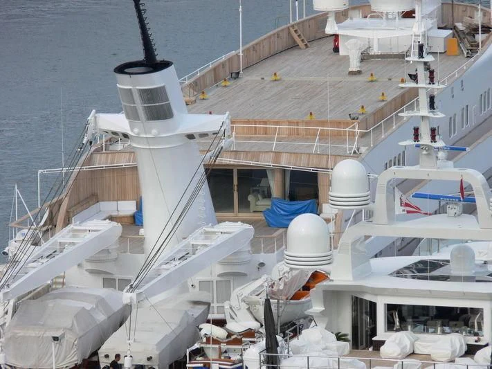 a large white boat with a black pole on the deck aboard ATLANTIS II Yacht for Sale