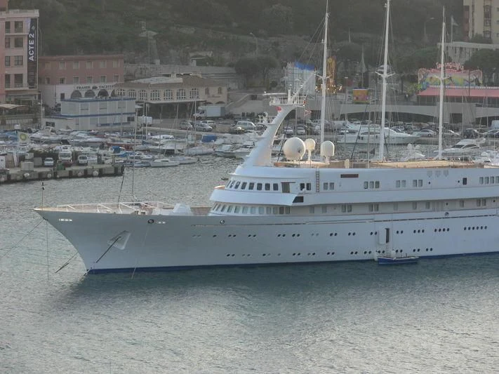 a large white boat in the water aboard ATLANTIS II Yacht for Sale